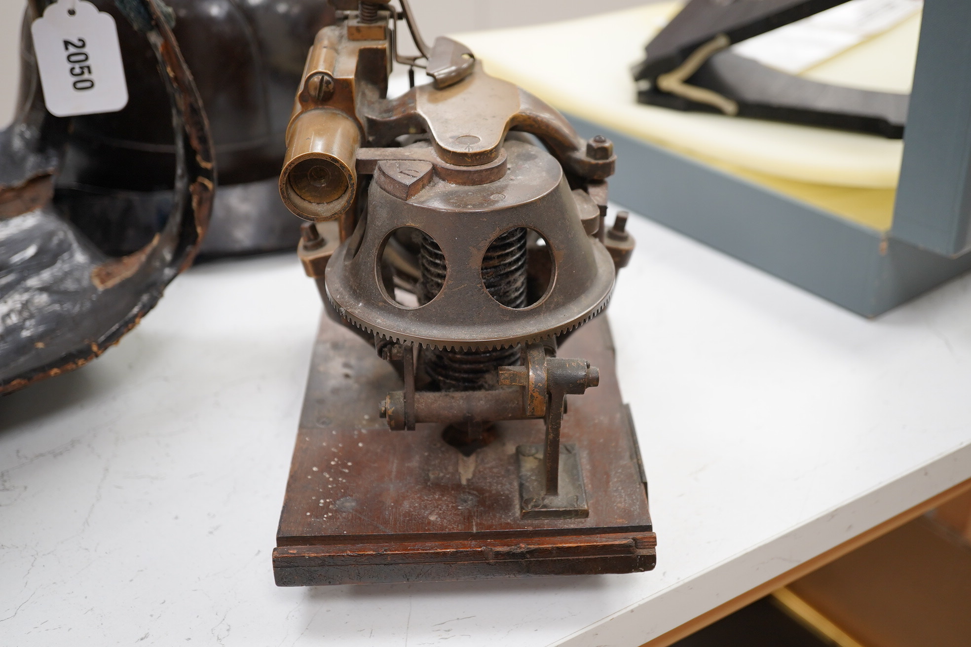 A First World War torpedo gyroscope, stamped 2878 W&Co. top part of the wooden case missing, 21cm high x 24cm wide. Condition - some general wear and damage, unknown if in working order.